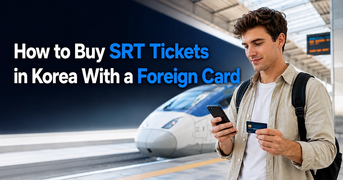 Traveler holding a smartphone and credit card inside a Korean high-speed rail station